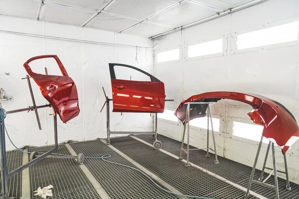 cars bamper and doors after paint in paint shop, after accident. High quality photo