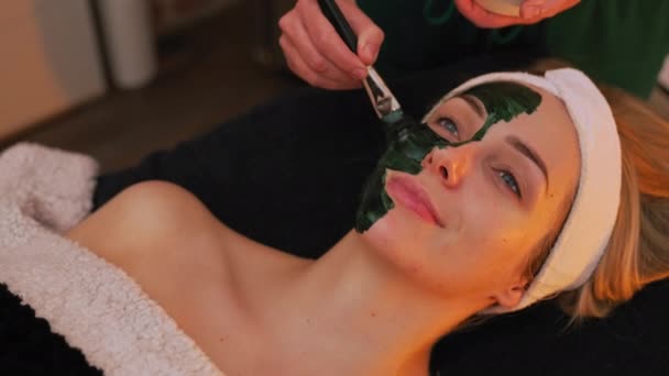 Beautician Applying Black Face Mask Her Clients Face Client Covered — Stock Video