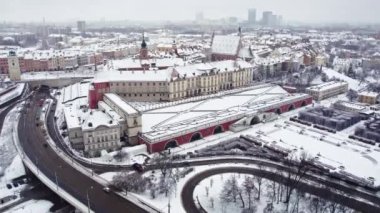 Birds eye view of the Old Town in Warsaw during winter. Beautiful architecture covered in snow. Warsaw Royal Castle. High quality 4k footage