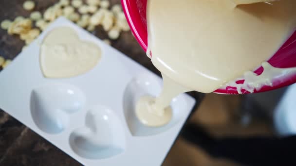 Pouring Melted White Chocolate Heart Shaped Plastic Molds Chocolate Production — Vídeos de Stock