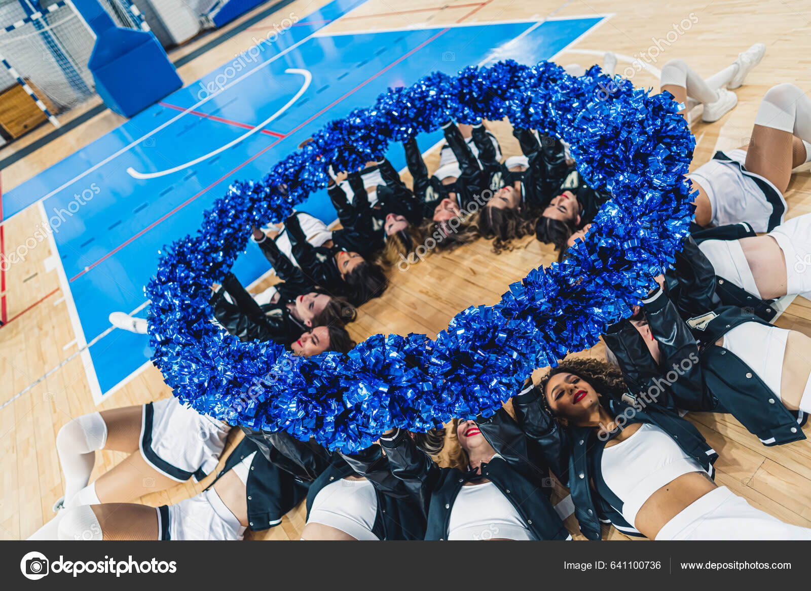 Cheerleaders Laying Floor Circle Holding Blue Pom Poms Indoors High Stock  Photo by ©PoppyPix 641100736