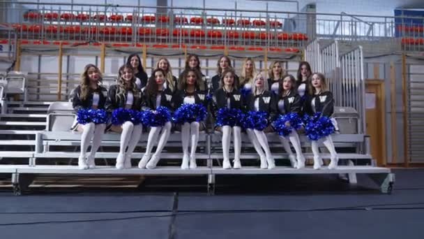 Team Cheerleaders Pompoms Sitting Chair Posing High Quality Footage — Stock Video