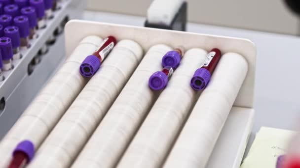 Four Blood Samples Being Agitated Centrifuge Other Samples Placed Test — Stockvideo