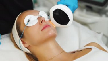 Woman receiving thermolifting procedure with eyes covered in cosmetology clinic. High quality 4k footage