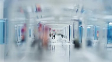 Inside image of blood samples and test tubes being moved around on a laboratorys belt conveyor. Blurred foreground. . High quality 4k footage