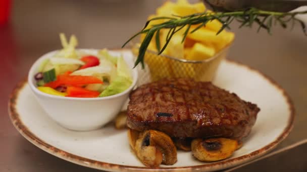 Chef Adds Rosemary Steak Metal Basket Fries Pickles White Plate — Video Stock