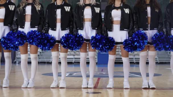 Cheerleaders Wearing White Tights Black White Uniforms Blue Pom Poms — Stock Video