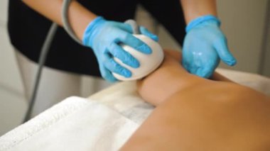 Doctor using ultrasound machine with gel for beauty ultrasonic massage therapy. High quality 4k footage