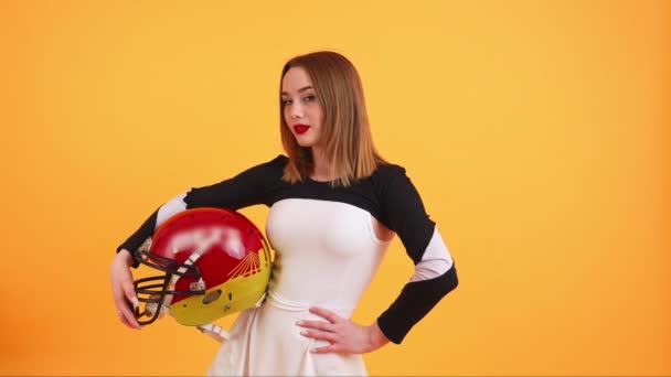 Medium Shot Young Attractive Cheerleader Posing American Football Helmet Orange — Stock Video