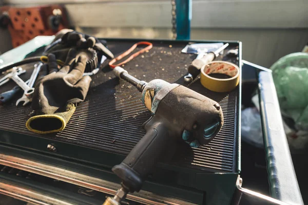 auto mechanics tools at the car garage, closeup shot, car repair concept. High quality photo