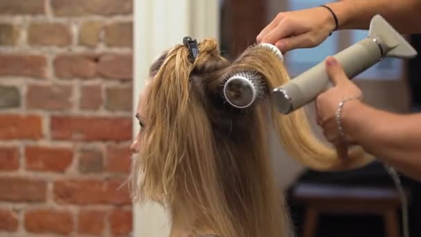 Barber Drying Female Client Hair Using Hairdryer Wrapping Section Hair — Stock Video