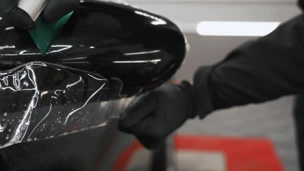Close Video Shot Smoothing Protection Film Put Car Mirror High — Stock Video
