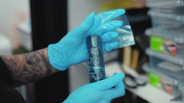Closeup Tattoo Artist Hands Prepping Tattoo Machine Plastic Wrap Making — Stock Video