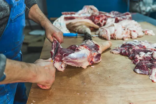 Meat processing in food industry, cutting pork into pieces. High quality photo