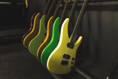 different color guitars in the music studio, musical concept. High quality photo clipart