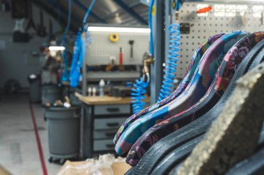 closeup shot of guitar different frames in the factory, producing guitars, guitar making process. High quality photo