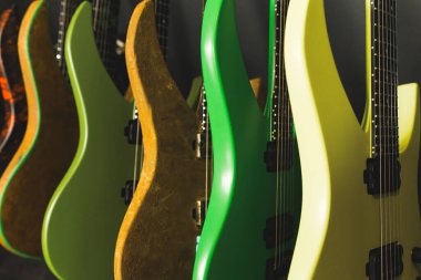 closeup of green and yellow guitars in the studio, a collection of electric guitars at the recording studio. High quality photo clipart