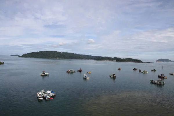 stock image ships boats fishing trollers on ocean sea water of south China sea bay kota Kinabalu sabah 