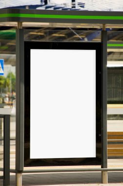 Outdoor advertising billboards at the bus stop.