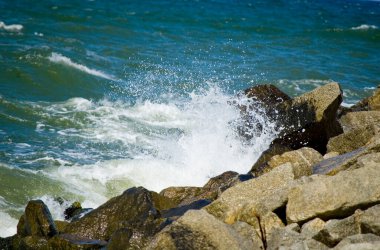 Waves crashes on to the rocks.