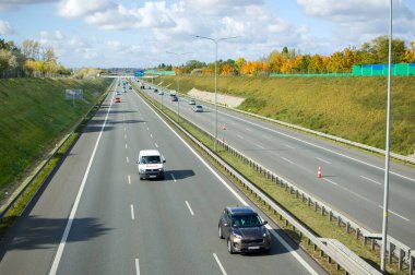 Poznan, Poland - October 9th 2022 - Polish A2 motorway with cars and trucks.