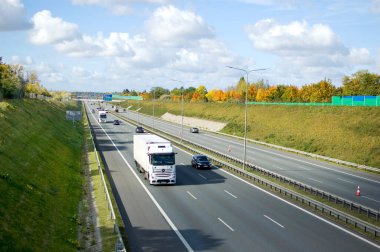 Poznan, Poland - October 9th 2022 - Polish A2 motorway with cars and trucks.