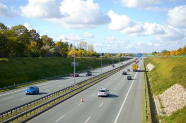 Poznan, Poland - October 9th 2022 - Polish A2 motorway with cars and trucks.