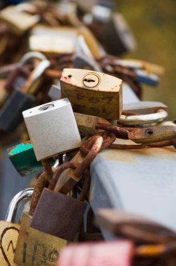 Series of colored padlocks of love. Selective focus.