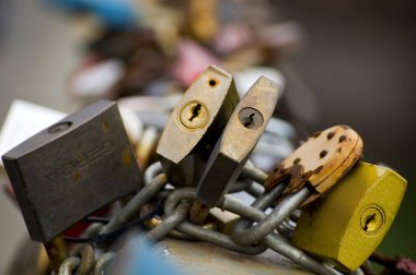 Series of colored padlocks of love. Selective focus.
