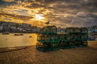 St Ives, Cornwall, England, UK - May 30, 2022: Evening sun and clouds over the harbour clipart