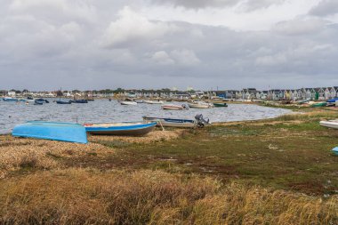 Mudeford Sandbank, Dorset, England, UK - September 27, 2022: View of the beach huts and the boats in Webb's Bay clipart