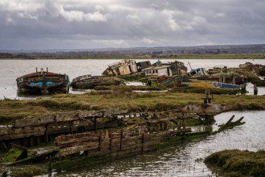 Hoo Marina Park, Kent, England, UK - March 21, 2023: Shipwrecks on the banks of the River Medway clipart