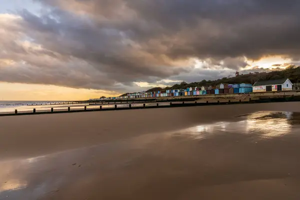 stock image Beach huts on the North Sea coast at Frinton-on-Sea, Essex, England, UK