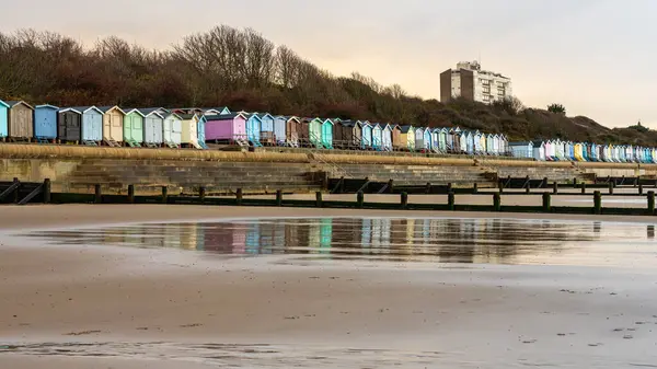 stock image Beach huts on the North Sea coast at Frinton-on-Sea, Essex, England, UK