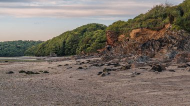 Wonwell Beach and low tide on the River Erme, with an old Lime kiln in the background, near Mothecombe, Devon, England, UK clipart