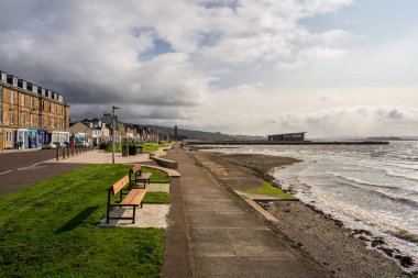 Helensburgh, Argyll and Bute, Scotland, UK - September 20, 2023: The promenade with the pier and the leisure centre in the background clipart