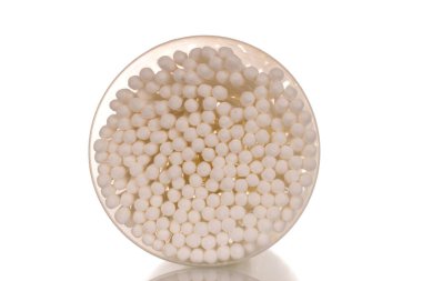 One plastic package of ear buds, macro, isolated on white background.