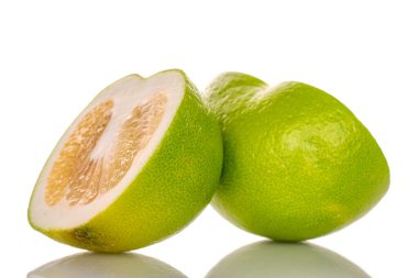Two half organic Citrus Sweetie, close-up, isolated on white.