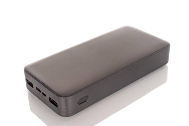 One black portable power bank charger close-up isolated on white background.