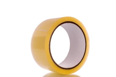 One roll of sticky tape, macro, isolated on white background.
