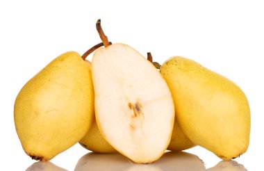 Several whole and one half organic yellow pears, close-up, isolated on white.