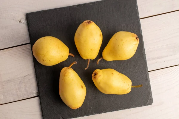 Five Natural Yellow Pears Wood Board Close Isolated White Top — ストック写真