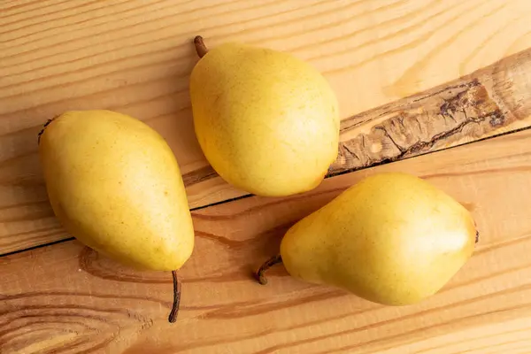 Three Natural Yellow Pears Close Wooden Table Top View — ストック写真