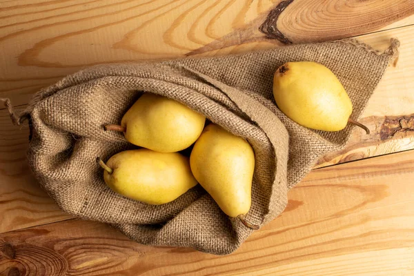 Several Ripe Yellow Pears Jute Sack Wooden Table Close Top — ストック写真