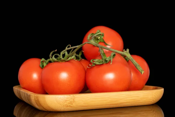 Several Fresh Tomatoes Branch Wooden Plate Macro Isolated Black Background — Stock Photo, Image