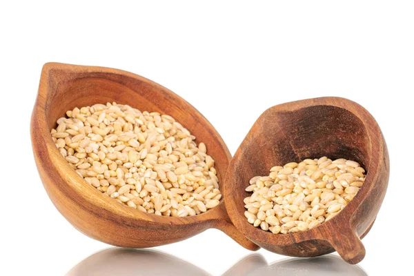 stock image Pearl barley in two wooden cups, macro, isolated on white background.