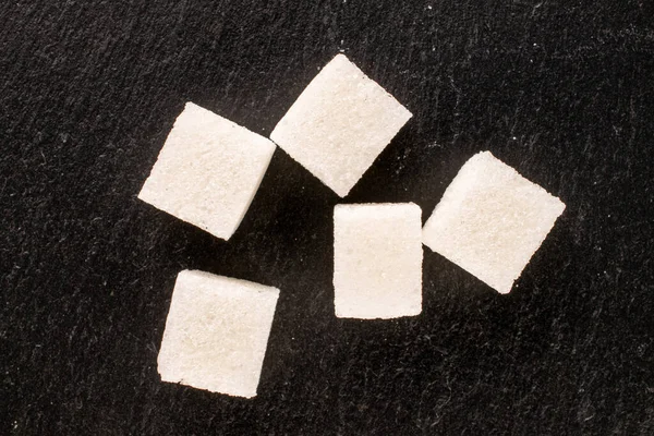 Vários Cubos Açúcar Branco Ardósia Pedra Macro Vista Superior — Fotografia de Stock