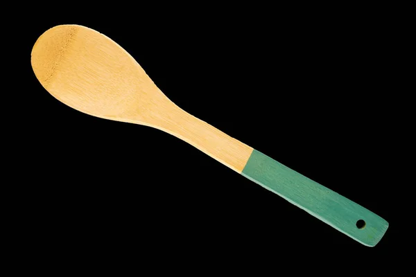 One Wooden Kitchen Spoon Isolated Black Background Macro Top View — Stock Photo, Image