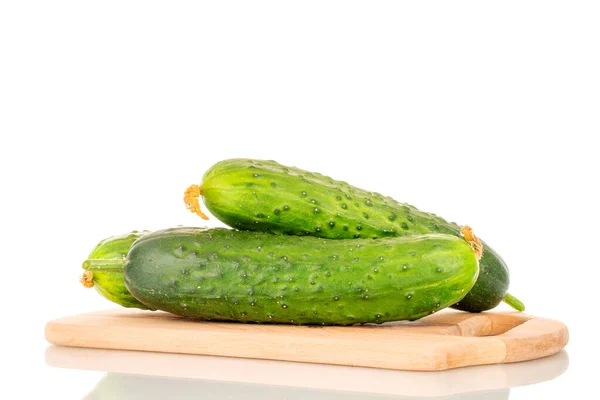 Three Ripe Cucumbers Wooden Kitchen Board Macro Isolated White Background — Stock Photo, Image