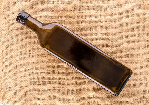 Eine Glasflasche Auf Jutetuch Makro Draufsicht — Stockfoto